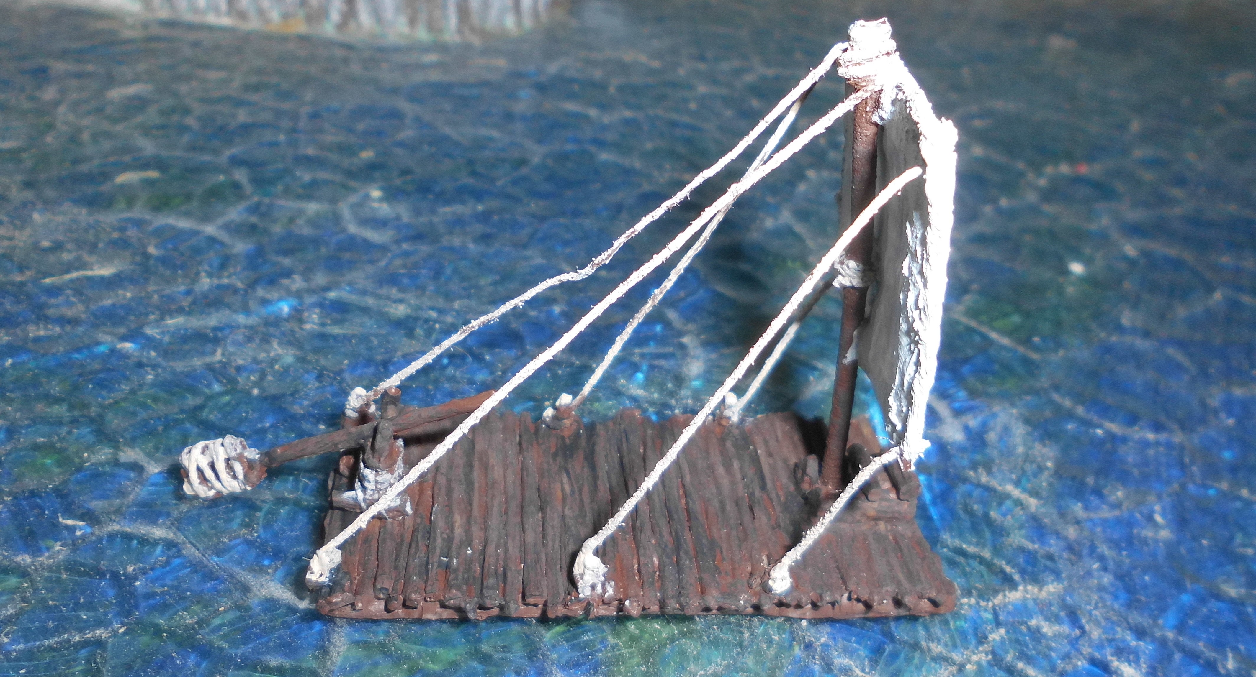 Ancient raft with sail